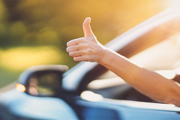 Thumbs up in car