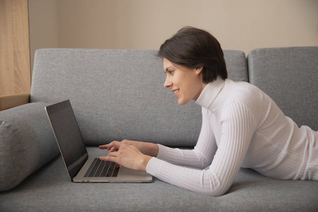 Woman working from couch