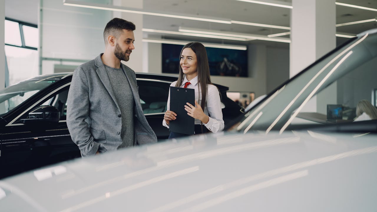 man and woman car shopping